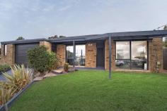 6 Bolton Court Langwarrin VIC 3910 $1,050,000 - $1,155,000 Set in a peaceful court position beside Bolton Court Reserve, 6 Bolton Court, Langwarrin presents a fresh and inviting family setting with modern interiors, flexible living spaces and outstanding outdoor appeal. Designed for everyday ease, the home offers four bedrooms and two bathrooms, with a warm blend of comfort and character throughout. Slate tiles feature across high-traffic areas, including the kitchen, meals and family spaces, while carpet adds softness to selected living areas and bedrooms. The main living zone includes downlights, exposed beams, a fireplace feature, split-system air conditioning and a wall-mounted heater, creating a welcoming space for relaxed family living. At the heart of the home, the kitchen combines stone benchtops, a stone island, glass splashback, Smeg cooktop and oven, double sink and generous cabinetry. The adjoining meals area includes electric heating, while additional storage, a laundry with sink and large built-in storage further enhance practicality. The main bedroom includes large windows, shutter blinds, a timber-lined ceiling, walk-in wardrobe and private ensuite with shower, toilet, vanity and face-level storage. Three further bedrooms offer flexibility for family, guests or study needs, supported by a main bathroom with bath, toilet and vanity. Outdoors, the home continues to impress with a large pergola, decking, raised garden beds, synthetic lawn, neat low-maintenance gardens and gated access directly through to the neighbouring reserve. A solar-heated swimming pool with waterslide adds a fun family focus, while solar panels, a garage with rear roller door access, stone driveway and side access add further appeal. Positioned within walking distance of Langwarrin Primary School and Elisabeth Murdoch College, and close to Langwarrin Flora and Fauna Reserve, Lloyd Park, The Gateway Shopping Centre and Karingal Hub, this is a ready-to-move-in family haven with lifestyle convenience at every turn.