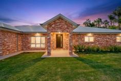 12A Claremont Drive Irymple VIC 3498 $1,650,000 - $1,815,000 Damian Portaro Principal & Managing Director proudly present for sale this near-new recycled brick residence, a true lifestyle property of scale, quality and serious entertaining power, set on a rare 2,196sqm allotment in one of Irymple's most impressive locations. Designed for families who want space, flexibility and premium finishes, the home offers four bedrooms, including a stunning master suite with a luxurious ensuite. A separate study with built-in desks provides an ideal work-from-home space, while three internal living zones, including a theatre room, kids' retreat and open plan family area, ensure everyone has room to spread out. At the heart of the home is a beautifully finished kitchen with concrete benchtops, a walk-in pantry and strong connection to the meals and living zone. From here, the dining area flows seamlessly to the enormous outdoor entertaining area, complete with decking, kitchenette and open fireplace, creating a space made for long lunches, celebrations and relaxed evenings with friends. The pool zone is another standout, with a stunning heat pump heated pool for year-round enjoyment and an adjoining pool room that takes entertaining to another level. Complete with kitchenette, bar, keg refrigerator and beer taps, plus an outdoor shower and outside toilet, this is a property built to be enjoyed. The enormous 16m fully insulated and lined shed includes a bathroom and mezzanine floor, with excellent access and enough turning room to easily reverse caravans, boats, trailers or toys. Add in a large rear yard, half-court basketball court, dual climate systems, 10kW inverter with 14.8kW of solar panels, FTTP internet, business-grade Wi-Fi points, Cat6 cabling, camera system and insulated internal walls, and you have a home that has been future-proofed with genuine thought. All of this sits within minutes' walk of the local pub and supermarket, while Irymple remains highly regarded for having one of the most sought-after schools in the district. This is more than a home. It is a complete family lifestyle package.