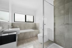9/281 Cranbourne-Frankston Road Langwarrin VIC 3910 $599,000 - $658,000 Crafted for comfort with a finish of finesse, this contemporary 3-bedroom townhome delivers breathtaking modern refinement with real architectural presence. Perfectly positioned just moments from The Gateway and Josephine Street shops, it's the perfect choice for first-time buyers, investors, and particular downsizers, with the ideal layout for all-age enjoyment and entertaining. Soaring ceilings across both levels amplify in the open lounge and dining rooms with large windows allowing the natural light to filter through, separated with a subtle split-level design that zones the spaces perfectly for significant furniture suites and easy movement from one space to the next. The kitchen's stone-topped island and pop of bright colour anchors all with presence and practicality, highlighted with premium appliances, plenty of storage, and easy movement outdoors to its adjacent patio and yard. Accommodation begins with a ground-floor primary suite with a walk-through robe to a full ensuite with stone counters, while upstairs, two further bedrooms with robes and split-system units share a beautifully-appointed family bathroom and a second lounge. Split-system air conditioning for the main lounge, fantastic storage, a powder room and laundry, a storage shed, a rainwater tank, and a double garage with internal access add further comfort and clout. As enticing as the home itself, a prime address sits metres from buses, The Gateway Shopping Centre, Josephine Street shops, and Langwarrin Park Primary, with Elisabeth Murdoch College, Langwarrin Plaza, Karingal Hub, and freeway access all nearby.