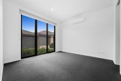 9/281 Cranbourne-Frankston Road Langwarrin VIC 3910 $599,000 - $658,000 Crafted for comfort with a finish of finesse, this contemporary 3-bedroom townhome delivers breathtaking modern refinement with real architectural presence. Perfectly positioned just moments from The Gateway and Josephine Street shops, it's the perfect choice for first-time buyers, investors, and particular downsizers, with the ideal layout for all-age enjoyment and entertaining. Soaring ceilings across both levels amplify in the open lounge and dining rooms with large windows allowing the natural light to filter through, separated with a subtle split-level design that zones the spaces perfectly for significant furniture suites and easy movement from one space to the next. The kitchen's stone-topped island and pop of bright colour anchors all with presence and practicality, highlighted with premium appliances, plenty of storage, and easy movement outdoors to its adjacent patio and yard. Accommodation begins with a ground-floor primary suite with a walk-through robe to a full ensuite with stone counters, while upstairs, two further bedrooms with robes and split-system units share a beautifully-appointed family bathroom and a second lounge. Split-system air conditioning for the main lounge, fantastic storage, a powder room and laundry, a storage shed, a rainwater tank, and a double garage with internal access add further comfort and clout. As enticing as the home itself, a prime address sits metres from buses, The Gateway Shopping Centre, Josephine Street shops, and Langwarrin Park Primary, with Elisabeth Murdoch College, Langwarrin Plaza, Karingal Hub, and freeway access all nearby.