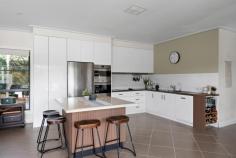 50 Old Quarry Circuit Helensburgh NSW 2508 Positioned in one of Helensburgh's most tightly held pockets, this solid brick family home enjoys a peaceful setting directly opposite the local park and duck pond, with beautiful valley views and a wonderful sense of privacy and space. Designed with family living in mind, this substantial home offers generous proportions throughout with two spacious living areas and an added rumpus room downstairs, creating flexibility for growing families who need room to spread out. The downstairs living spaces flow effortlessly to a covered entertaining area overlooking the sparkling inground pool, creating the perfect setting for weekend gatherings and relaxed everyday living. Filled with plenty of north facing sunshine, the home feels bright, warm and inviting throughout the day. Large windows have been thoughtfully incorporated across all bedrooms and living spaces, allowing beautiful natural light to pour in while framing the surrounding leafy outlook. Accommodation includes five generous bedrooms, all complete with built in robes, while the spacious main bedroom enjoys the added convenience of its own ensuite. Each bedroom offers an abundance of space, making this an ideal family home where everyone can enjoy their own retreat. Downstairs features practical tiled flooring and a combustion fireplace that creates warmth and atmosphere during the cooler months, while upstairs offers floating timber floors for a modern and welcoming feel. A wrap around balcony upstairs captures peaceful views across the duck pond, surrounding bushland and valley outlook, offering the perfect place for a morning coffee or evening unwind. Outside, established low maintenance gardens and privacy hedges create a peaceful setting while the secure yard provides a safe space for children and pets to play. Set in a quiet, highly sought after location only moments from schools, shops, cafes and transport, this home delivers the lifestyle many families have been searching for. Property highlights: Highly sought after family friendly location Opposite parklands and duck pond Quiet street with valley and bushland views Solid brick construction Solar Panels 5 large bedrooms with built in robes Main bedroom with ensuite 2 living areas plus separate rumpus room downstairs Covered outdoor entertaining area overlooking pool Inground swimming pool Combustion fireplace downstairs Tiled downstairs living areas Floating timber floors upstairs Large windows throughout allowing beautiful natural light Wrap around balcony with peaceful outlook Established low maintenance gardens with privacy hedges Secure yard ideal for children and pets Ducted heating and cooling Double parking Close to schools, shops, cafes and public transport Location is key here, with the property an easy walk to Helensburgh shops, cafes and restaurants. A short drive to the Helensburgh Train Station, making it perfect for commuters looking for an easy 50-minute journey into Sydney. Picturesque Stanwell Park Beach is less than 10 minutes drive. Enjoy Coastal living without the huge price tag. This is one of the only remaining areas where you can find a peaceful regional lifestyle less than an hour from Sydney. It offers all of those charming lifestyle benefits that one would associate with small town living:- bushwalking, swimming holes, bike tracks, sporting clubs, cafes and of course plenty of friendly people. This is a fantastic opportunity to secure a modern, move-in ready home in a premium Helensburgh location. Don't miss your chance to make it yours.