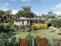 17 Gardiner Place Helensburgh NSW 2508 Set in one of Helensburgh's peaceful cul-de-sac pockets, this property delivers the kind of lifestyle buyers are always searching for but rarely find - quiet surroundings, leafy outlooks and a generous rear deck that flows directly onto a landscaped backyard and the bushland beyond. Backing onto the edge of the Royal National Park and being only minutes walk from the train station, the home offers an easy sense of escape while still keeping life's little conveniences close by. Morning coffee on the deck, treetop views and a backyard made for children, pets or relaxed weekend entertaining. No chaos, no fuss - just a proper home with room to breathe. YOUR HOME • Single-level 3 bedroom, 2 bathroom layout designed for easy everyday living and low-maintenance comfort. • Light-filled living, kitchen and dining zones flow through to the large covered rear deck, creating a seamless connection between indoors, outdoors and the surrounding bushland. • The spacious deck is a true highlight of the home. It's private and perfectly positioned to take in the leafy outlook across the backyard and treeline beyond. Whether you're entertaining friends or enjoying alfresco dining with family during those warm summer nights, it is sure to create a backdrop for many happy memories. • Well-appointed kitchen with ample bench space, gas cooking, breakfast bar seating and a beautiful outlook. • Three comfortable bedrooms, including a master bedroom with ensuite and built-in robe. • Main bathroom with separate bath, shower and toilet, ideal for families. • Fully fenced landscaped backyard with a sunny aspect and plenty of space for children and pets to enjoy. • Single lock-up garage with space for additional off-street parking. • Positioned on a generous 777m² parcel with R2 residential zoning. LOCATION • Positioned in a peaceful and quiet cul-de-sac with no through traffic. • Backing directly onto bushland, offering a rare sense of privacy and connection to nature. • Helensburgh train station is a short walk from your front door, making the home ideal for commuters. Avoid the parking issues and leave the car at home. • Only moments drive from Helensburgh local schools, shops, cafés and village amenities. • Easy access to the Royal National Park, coastal beaches, walking tracks and the relaxed outdoor lifestyle Helensburgh is known for. Approximately one hour south of Sydney CBD and around 30 minutes north of Wollongong. With its single-level design, peaceful setting and beautiful bushland backdrop, this is a home that feels calm from the moment you arrive. Whether you are upsizing, downsizing or searching for a family-friendly home close to nature, 17 Gardiner Place offers space, privacy and lifestyle in equal measure.