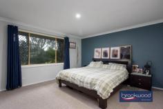 6 Gibbings St Northam WA 6401 $949,000 There are homes you walk into and immediately start imagining your life there – where the kids would sleep, where you’d have your morning coffee, what Sunday afternoons might look like. This is one of them. A large, well-built brick-and-iron family home sitting on a generous 3,475 sqm corner block with two street frontages, zoned R30 – meaning the picture here isn’t only about the present – It’s about what this place is right now, and what it can become. 5 bed 2 bath 3 WC Zoned for development Open plan living zone Renovated kitchen Renovated bathrooms Games room & pool Powered workshop Solar & scheme water R30 – 3,475 sqm block Corner dual frontage The entry hall is the first clue. It’s large and unhurried, the kind of scale that tells you something about everything that follows. To the right, the principal suite – east-facing, freshly carpeted with a plush textured pile and fitted with a walk-in robe. The ensuite is fully tiled, finished in soft, calm tones and tucked behind a barn-hung door. It’s a room that’s easy to be in. Quiet. Settled. The kitchen, family room and meals area occupy the middle of the home, where most of daily life will happen. The kitchen has been properly updated – stone benchtops, white soft-close cabinetry, a 900mm oven, gas hob and dishwasher. A slow-combustion fireplace anchors one end of the room. A split-system handles all seasons. Doors open to the alfresco area, and a north-facing window frames the pool. On a winter afternoon with the fire going, this room makes a strong case for itself. Three carpeted bedrooms for the kids, each with built-in robes, share a bathroom that’s been renovated in a similar vein to the ensuite – calm finishes, full tiling, a tub. A walk-through laundry sits nearby. The layout of this part of the home is straightforward and practical. Step outside, and the scale of the block starts to make itself known. The entertaining area is paved and looks over the pool and gazebo, with a built-in BBQ for good measure. The games room adjoins the pool directly – air-conditioned, bar-equipped, big enough for a pool table. Beside the gazebo, a separate structure houses a third WC and dedicated storage for pool equipment. It’s the kind of setup that makes you think about summer differently. Through a rear gate, and with vehicle access via a side lane, is a powered and plumbed 8 m x 8 m workshop with a lean-to. A small garden offers additional storage space. The current owners call the long stretch of open lawn along the Byfield Street frontage “the oval” and on weekends it earns the name with games, kick-to-kick and backyard cricket. It’s also the most obvious place to start a conversation about what this block could look like in ten years. With R30 zoning and two street frontages, the development potential (STCA) is straightforward and real. The land is there. The zoning is there. The rest is timing. There’s a version of this property that looks exactly as it does today – full of a family who never want to leave. There’s another version that looks quite different in ten or fifteen years. This home asks you to think about both – and gives you enough room, in every sense, to answer that question on your own terms.