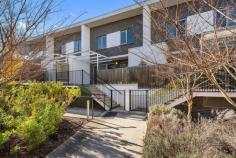 20/5 Nevertire Street Lawson ACT 2617 $599,000 Offering an outstanding combination of space, functionality and convenience, this contemporary townhouse presents an exceptional opportunity for owner-occupiers and investors alike. Thoughtfully designed across three levels, the home delivers generous living spaces, excellent separation between living and accommodation zones, and a private outdoor retreat rarely found in townhouse living. The ground floor is dedicated to everyday living, featuring a spacious open-plan lounge and dining area that flows seamlessly to the expansive private courtyard. Whether entertaining guests, enjoying a morning coffee or simply relaxing outdoors, this versatile space extends the home's living footprint and enhances its lifestyle appeal. The well-appointed kitchen is positioned at the heart of the home, offering ample bench space, excellent storage and a practical layout for daily use. Enhanced by high ceilings across both levels, double-glazed windows and ducted air conditioning throughout, the home offers year-round comfort, energy efficiency and an added sense of space and natural light. Upstairs, two generous bedrooms provide comfortable accommodation, each complete with built-in robes and their own ensuite bathroom. This highly functional configuration is ideal for professionals, small families, downsizers or those seeking flexibility for guests and shared living arrangements. Completing the package is a secure basement level with an oversized double garage and internal access, providing valuable storage and convenience. Situated in the highly sought-after suburb of Lawson, you'll enjoy easy access to the University of Canberra, Australian Institute of Sport, Belconnen Town Centre, Lake Ginninderra, local schools, cafes, parks and public transport. Combining lifestyle, location and practicality, this is a home designed to suit modern living. Internal living area - 86m² Private courtyard - 28m² Double garage - 46m² Total area - 160m² Body Corporate - Approx. $1,247 p/q Property Features Two spacious bedrooms, each with a private ensuite Built-in robes to both bedrooms Light-filled open-plan living and dining area Functional kitchen with ample bench space and storage High ceilings on both levels, enhancing space and natural light Double-glazed windows for improved comfort, energy efficiency and noise reduction Ducted air conditioning throughout for year-round climate control Large private courtyard, ideal for entertaining and outdoor relaxation Additional powder room on the ground floor, perfect for guests and day-to-day convenience Separate internal laundry Secure basement double garage with internal access Practical three-level floorplan offering excellent separation between living and accommodation zones Excellent lock-up-and-leave convenience with secure parking and storage space Low-maintenance lifestyle in a highly convenient location Close to Belconnen Town Centre, University of Canberra and Lake Ginninderra Easy access to public transport, parks and walking trails