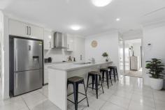 1/1 Bellavista Cct Beaconsfield QLD 4740 Impeccably presented and thoughtfully designed, this superb three-bedroom unit delivers the perfect combination of contemporary style, comfort and low-maintenance living. Privately positioned in a quiet location adjacent to parkland, the property offers house-like proportions, quality finishes and an impressive list of features that make it exceptional value. The open-plan kitchen, dining and living area flows seamlessly to the tiled outdoor alfresco, creating an inviting space to relax or entertain. The kitchen is well-appointed with a near-new oven and cooktop, while quality tiles, split-system air-conditioning and ceiling fans throughout ensure year-round comfort. The master bedroom features a walk-in wardrobe and stylish ensuite, while the two additional bedrooms are generously sized and include built-in wardrobes. Both bathrooms have been finished with a touch of luxury and finesse, adding to the home's modern appeal. Additional features include security screens and blinds to all windows and sliding doors, NBN connection, ample storage, separate laundry, double remote garage, automatic irrigation system, landscaped surrounds, fencing, clothesline and letterbox. Energy efficiency is also well catered for with a 5.2kW solar system, helping to reduce ongoing running costs. With no active body corporate, the seller's contribution to insurance is just $1,360 per annum, with gross rates of approximately $1,828.00 per half year. For investors, the property also offers an attractive rental appraisal of approximately $640 to $660 per week. Offering space, privacy, style and affordability, this impressive property is sure to appeal to first-home buyers, downsizers, investors and anyone seeking a quality, easy-care home.