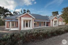 58 Haddon Preston Hill Road Haddon VIC 3351 $1,150,000 - $1,190,000 Nestled on approximately 8.4 picturesque acres amongst established gums, this exceptional Bryan Peterson-built residence delivers the perfect blend of quality craftsmanship, spacious family living and peaceful country lifestyle, all within a short drive of Delacombe Town Centre for everyday convenience. Designed with growing families in mind, the expansive floorplan offers generous proportions throughout, including a luxurious master retreat with sitting area complete with a large walk-in robe and stylish ensuite. High ceilings, stunning Blackbutt timber flooring and beautiful recycled brick creates a warm and sophisticated atmosphere, while premium finishes and quality appliances ensure the home is as practical as it is impressive. At the heart of the home, the beautifully appointed kitchen boasts a large butler's pantry, providing ample storage and preparation space for those who love to cook and entertain. Multiple living areas options offer room for the whole family to spread out, while ducted heating and cooling throughout, complemented by a cosy fireplace, provide year-round comfort. Step outside to the expansive undercover alfresco area, perfectly designed for entertaining family and friends while taking in the tranquil surrounds. The property also offers the best of both worlds with town water, tank water, a fox-proof chook house and a dam and plenty of open space to enjoy a relaxed rural lifestyle without sacrificing modern convenience. Offering outstanding quality, space and lifestyle in a sought-after location, this is a rare opportunity to secure a premium acreage property that truly has it all. This stunning high-end home is sure to impress so be quick and don't miss out on this opportunity to view.