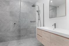 52 Bonar St Maitland NSW 2320 $995,000 to $1,050,000 The crown jewels of the Enclave Development, this exceptional masterfully built and architecturally designed villa redefine low-maintenance luxe. Offering three generous bedrooms, two beautifully appointed bathrooms and an uncompromising commitment to quality, every element of this build has been carefully considered to deliver a home of timeless style, substance and sophistication. Stepping inside, you're immediately welcomed by rich hardwood parquetry flooring and bespoke wainscoting, setting the tone for the calibre that continues throughout. Beyond, and into the heart of the home the parquetry flooring becomes an unmistakable centrepiece, beautifully complemented by crisp neutral interiors, plantation shutters and soaring ceilings that enhance the sense of space and natural light. The expansive open plan living and dining domain is warm, elegant and effortlessly inviting, flowing seamlessly to a stunning designer kitchen featuring stone benchtops, shaker cabinetry, induction cooking, dual ovens, a warming drawer and exceptional storage. The sleeping arrangements comprises of three generously proportioned bedrooms, each appointed with plush carpeting, plantation shutters and built-in robes. The impressive master suite enjoys a walk-in wardrobe, beautifully finished ensuite and direct access to the rear verandah, while the main bathroom mirrors the same level of craftsmanship with floor-to-ceiling tiling and premium fixtures throughout. Extending naturally from the living area, the fully covered Evo Wood entertaining deck provides the perfect setting to relax or entertain while taking in the peaceful semi-rural outlook. The secure, fully fenced internal yard offers ample room for children and pets to enjoy, while the property's generous landholding of approximately 1,086sqm extends to the rear treelined boundary, providing space rarely found. Every detail of this remarkable residences has been thoughtfully executed, creating a home that balances luxury finishes with everyday comfort. Offering a level of craftsmanship seldom seen in today's market, this is an opportunity to secure one of the Enclave's finest homes-an inspection will leave a lasting impression.