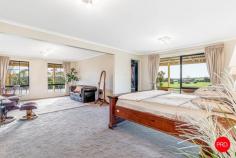 253 Mulberry Lane Lockwood South VIC 3551 $1,050,000 - $1,150,000 Set across approximately 11.4 acres in the peaceful Lockwood South landscape, 253 Mulberry Lane delivers an established lifestyle property with space, privacy and practical family appeal. Surrounded by rolling paddocks, mature gums and wide country outlooks, the home offers the calm of rural living while remaining within comfortable reach of Bendigo, Kangaroo Flat, Maiden Gully and surrounding amenities. Privately positioned well back from the road, the property makes an immediate impression with its long driveway approach, landscaped surrounds and generous sense of arrival. The land is a major part of the appeal, offering open usable acreage, established garden areas, water infrastructure and excellent shedding, creating flexibility for families, hobby farmers, tradies, machinery storage or buyers simply seeking more room to move. Built in 2007, the residence has been designed with comfort, proportion and everyday liveability in mind. The floorplan offers four bedrooms, two bathrooms, two living areas and an attached two-car garage with remote entry, with wide hallways, neutral interiors and generous room sizes contributing to a relaxed and functional feel throughout. At the centre of the home, the kitchen, dining and main living zone forms an inviting everyday hub. The kitchen features excellent bench space, abundant cabinetry, a central island, pantry storage, gas cooktop and electric oven, with easy connection to the adjoining dining area and outdoor entertaining space. Large windows and sliding doors frame the surrounding greenery, allowing natural light and rural views to remain a constant feature. A second living area provides valuable flexibility for families, guests or quieter relaxation, while the primary suite offers impressive proportions, a walk-in robe, private bathroom and adjoining sitting area. The remaining bedrooms are positioned within their own wing, with built-in robes to all bedrooms and convenient access to the main bathroom, separate toilet and laundry. Comfort and practicality are well covered with ducted heating and cooling, solar hot water, bottled gas, septic, NBN connection and solar. These features support the ease of day-to-day living while complementing the scale and self-sufficient nature of the property. Outdoor living is another clear highlight, with a substantial covered patio providing an ideal space to entertain, unwind and enjoy the open outlook. The inground swimming pool, with solar heating and in floor cleaning, adds strong lifestyle appeal, creating a private area for family enjoyment throughout the warmer months. Beyond the home, the property includes a large, powered shed with 3-phase power, additional shedding, water tanks and a dam, further enhancing its usability. Whether you need storage, workspace, room for animals, space for hobbies or simply a peaceful acreage setting to enjoy, the infrastructure here is already well established. Offering a spacious family home, pool, shedding, solar, water storage, dam and approximately 11.4 acres of usable Lockwood South land, 253 Mulberry Lane presents a well-rounded lifestyle opportunity with the space, comfort and flexibility to suit a wide range of buyers.
