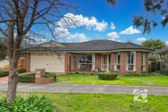 19 The Promenade Narre Warren South VIC 3805 $770,000 - $820,000 The best value home in 3805 Nestled in the prestigious Hillsmeade Estate, this immaculately presented residence delivers an exceptional lifestyle in a highly sought-after location. Designed for comfortable, family living, this home comprises three generous bedrooms plus a versatile study, that can be easily utilised as a fourth bedroom. The spacious Master features a walk-in robe and private ensuite, while the remaining bedrooms are serviced by a large bathroom complete with a relaxing spa bath. Boasting three separate living areas, the home delivers excellent floorplan for both relaxing and entertaining. At the heart of the home is a beautiful original oak timber kitchen, featuring ample bench and storage space, and a practical layout ideal for everyday living. Year-round comfort is assured with ducted heating and evaporative cooling, while added extras such as an alarm system and double remote garage with rear access further enhance the home's appeal. Outside, a covered pergola overlooks beautifully landscaped gardens, providing the perfect setting for entertaining family and friends. Ideally located close to quality schools, shopping centres, parks and public transport, this charming residence presents an outstanding opportunity to secure a home in one of Narre Warren South's most desirable estates.