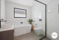 1 / 73-75 Lake Entrance Road Oak Flats NSW 2529 From the moment you arrive, this beautifully presented townhouse offers a sense of privacy and quality that is often hard to find. Positioned at the front of the complex with its own private entrance and surrounded by established gardens, it delivers the comfort and proportions of a home while retaining the ease of low maintenance living. Step inside and you will immediately appreciate the generous scale of the interiors. High ceilings enhance the feeling of space, while the thoughtfully designed floorplan provides completely separate living and dining zones, allowing room for both everyday living and entertaining. The kitchen is a standout feature, combining timeless style with modern practicality. Stone benchtops, an integrated dishwasher, plumbed fridge space and extensive storage create a space that is equally suited to busy family life or hosting guests. Large stacker doors draw the outdoors in, opening to a covered alfresco area where weekend barbeques, morning coffees and relaxed evenings can be enjoyed against a backdrop of picturesque gardens. The seamless connection between the indoor and outdoor spaces gives the home an inviting, open feel throughout the seasons. Ducted air conditioning throughout, upstairs has 3 generous bedrooms including a spacious master suite complete with ensuite. The main bathroom offers a touch of luxury with a freestanding bath, while the inclusion of 3 toilets adds everyday convenience. Located just moments from Oak Flats shopping precinct, Shellharbour City Centre, the bowling club, schools, cafés, public transport and the waterfront lifestyle of Lake Illawarra, this is a home that combines modern comfort with exceptional convenience. HIGHLIGHTS • Near new townhouse with house like proportions • Privately positioned at the front of the complex with its own entrance • High ceilings and ducted air-conditioning • Stylish kitchen with stone benchtops and quality inclusions • Separate living and dining areas • Seamless indoor-outdoor flow via stacker doors • Covered alfresco overlooking beautifully landscaped gardens • Master bedroom with ensuite • Freestanding bath to the main bathroom • 3 toilets and excellent storage throughout • Double garage with internal access • Convenient location close to shops, cafes, transport, bowling club and Lake Illawarra Offering the perfect balance of style, privacy and practicality, this is the kind of home that allows you to spend less time maintaining and more time enjoying everything the Oak Flats lifestyle has to offer.