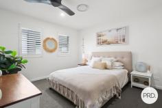 1 / 73-75 Lake Entrance Road Oak Flats NSW 2529 From the moment you arrive, this beautifully presented townhouse offers a sense of privacy and quality that is often hard to find. Positioned at the front of the complex with its own private entrance and surrounded by established gardens, it delivers the comfort and proportions of a home while retaining the ease of low maintenance living. Step inside and you will immediately appreciate the generous scale of the interiors. High ceilings enhance the feeling of space, while the thoughtfully designed floorplan provides completely separate living and dining zones, allowing room for both everyday living and entertaining. The kitchen is a standout feature, combining timeless style with modern practicality. Stone benchtops, an integrated dishwasher, plumbed fridge space and extensive storage create a space that is equally suited to busy family life or hosting guests. Large stacker doors draw the outdoors in, opening to a covered alfresco area where weekend barbeques, morning coffees and relaxed evenings can be enjoyed against a backdrop of picturesque gardens. The seamless connection between the indoor and outdoor spaces gives the home an inviting, open feel throughout the seasons. Ducted air conditioning throughout, upstairs has 3 generous bedrooms including a spacious master suite complete with ensuite. The main bathroom offers a touch of luxury with a freestanding bath, while the inclusion of 3 toilets adds everyday convenience. Located just moments from Oak Flats shopping precinct, Shellharbour City Centre, the bowling club, schools, cafés, public transport and the waterfront lifestyle of Lake Illawarra, this is a home that combines modern comfort with exceptional convenience. HIGHLIGHTS • Near new townhouse with house like proportions • Privately positioned at the front of the complex with its own entrance • High ceilings and ducted air-conditioning • Stylish kitchen with stone benchtops and quality inclusions • Separate living and dining areas • Seamless indoor-outdoor flow via stacker doors • Covered alfresco overlooking beautifully landscaped gardens • Master bedroom with ensuite • Freestanding bath to the main bathroom • 3 toilets and excellent storage throughout • Double garage with internal access • Convenient location close to shops, cafes, transport, bowling club and Lake Illawarra Offering the perfect balance of style, privacy and practicality, this is the kind of home that allows you to spend less time maintaining and more time enjoying everything the Oak Flats lifestyle has to offer.