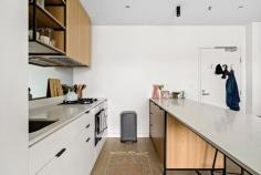 114/44 Gillies St Fairfield VIC 3078 EOI $400,000 - $440,000 Expressions of Interest Closing Wednesday 12 August at 5pm Contemporary unit, walk to station & cafes Brilliantly positioned in the acclaimed 'Greenwich' complex, this sophisticated one-bedroom apartment delivers the ultimate in vibrant inner-city living. Securely tucked away yet offering immediate doorstep access to Fairfield Station, an on-site ground-floor café, and a lush communal garden, the location is simply unmatched. Inside, contemporary timber-look flooring anchors a superb open-plan meals and living zone. Seamlessly flowing out to a private balcony, it offers the perfect layout for morning coffees or effortless evening relaxation. The masterfully designed entertainer’s kitchen serves as the home's striking hub. It showcases premium stone benchtops, a versatile island bench, a dual-tone palette of crisp white and warm timber cabinetry, a gas cooktop, a dishwasher, and a sleek integrated fridge. Rest and relaxation are assured in the generous bedroom, complete with a massive built-in robe. It is well-serviced by a huge, fully-tiled bathroom boasting premium floor-to-ceiling tiling and a large shower. Further highlights include a clever European laundry, split-system heating/cooling, a dedicated undercover car space, a handy storage cage, a bike shed, and ample guest parking. Embrace a life of total convenience. You are just steps away from the iconic Station Street Shopping Village, bustling cafes, gourmet grocers, and the scenic Yarra River walking trails. It is an exceptional opportunity for first-home buyers, professionals, and savvy investors alike.