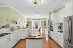 6 Sovereign Ct Mount Barker SA 5251 $1,600,000 - $1,700,000 Waterford Sanctuary: Federation Charm, Workshop Shed, and 1.13 Acres of Pure Lifestyle There are properties that offer a house on a block, and then there are properties that offer a whole way of life. This 2003 McCracken Homes Federation-style build on 1.13 acres in the sought-after Waterford precinct is firmly in the second category. From the drive-through motorhome access and three-phase workshop shed to the established orchard and 45,000-litre rainwater system plumbed through the home, every corner of this cul-de-sac holding has been developed with intention, and it shows. Inside, nine-foot ceilings and quality solid timber internal doors set a tone that carries from the formal living room through to the rear of the home. The formal living space features timber flooring and a Nectre slow-combustion wood heater, while the separate formal dining room anchors itself with a bay window overlooking the gardens. The kitchen is a proper working hub, with an island bench, walk-in pantry, and a new Bosch dishwasher, opening through to the meals and family living area where a second Nectre wood heater and split-system air conditioning make year-round comfort effortless. Ducted evaporative cooling runs throughout the whole house, and new LED fittings have replaced every halogen across the property. The raised timber deck and large pitched-roof pergola entertaining area is where the Adelaide Hills seasons really come alive. Morning coffee with orchard views across cherry, Fuji apple, Gala apple, nectarine, mulberry, lime, passionfruit, plum, lemon, orange, mandarin, almond, and more; summer evenings under the pergola with the garden doing the heavy lifting. Raised vegetable beds on mains water, automatic mains-fed drip irrigation to the garden, pine bark mulched bush-walk paths, and a garden shed with shelving round out a rear garden that is genuinely established and entirely usable. The master bedroom is generously proportioned with a walk-in robe and ensuite, while one further bedroom features a built-in robe. The fourth bedroom, currently a study but noted by agents as another big bedroom, adds real flexibility. The main bathroom delivers a twin vanity, spa bath, and separate shower, and new toilets have been fitted across both bathrooms. The shed is the headline act for anyone who works with their hands, runs a trades business, or needs serious vehicle storage. Three-phase power, a concrete floor, a vehicle inspection pit, an overhead crane with trolley and chain hoist, eight-tube LED lighting, security cameras, internet connectivity, and a mezzanine level with properly engineered structural flooring make this a workshop that means business. A manual 500kg chain hoist is also included. Drive-through access from the double garage accommodates a 7.9-metre motorhome or 20-foot caravan with ease, a rare find at this price point in the Hills. What you'll love: • Entertainer's Edge: Raised timber deck and large pitched-roof pergola entertaining area with established orchard views across fifteen-plus fruit and nut varieties. • Workshop Benchmark: Three-phase shed with concrete floor, inspection pit, overhead crane with trolley and chain hoist, mezzanine level, LED lighting, and drive-through caravan or motorhome access. • Water Independence: 45,000 litres of rainwater storage plumbed to the full house, including a dedicated 22,500 litres for rear garden irrigation. • Energy Efficiency: 9kW solar system split across house and shed roofs with internet-connected monitoring, solar hot water, plus dual Nectre slow-combustion heaters and ducted evaporative cooling. • Custom Character: Solid timber internal doors throughout and nine-foot ceilings across the whole home. • Connected Infrastructure: NBN fibre to the premises with data points, a patch panel, and structured cabling throughout. • Lifestyle Location: 1.13-acre cul-de-sac position in the Waterford precinct with established landscaping, bush-walk paths, and room to breathe. For the buyer who wants genuine land, a serious workshop, a productive garden, and a Federation-character home that has been upgraded thoughtfully over two decades, this Waterford holding is a rare and complete package. All information provided has been obtained from sources we believe to be accurate, however, we cannot guarantee the information is accurate and we accept no liability for any errors or omissions.