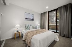 Unit 217/61 Cooyong St Braddon ACT 2612 $499,000 Upgraded North-East Facing Apartment with Bathtub and Serene Treeline Views Positioned within the prestigious SOL precinct and directly opposite Canberra Centre, this beautifully upgraded one-bedroom apartment presents an exceptional opportunity to enjoy premium city living without compromising on peace and privacy. Enjoying a highly sought-after north-east aspect, the apartment is bathed in natural light throughout the day while overlooking a quiet, tree-lined street. Unlike many city apartments facing busy roads, this home offers a tranquil outlook with leafy views and a surprising sense of serenity in the heart of Canberra. Stepping inside, you're welcomed by a spacious designer kitchen featuring a large island benchtop, premium SMEG appliances and generous storage, creating the perfect space for everyday living and entertaining. Timber flooring flows through the open-plan living and dining area, while floor-to-ceiling double-glazed windows maximise natural light and connect seamlessly to the oversized balcony. Whether enjoying your morning coffee surrounded by greenery or relaxing with a glass of wine after work, the balcony provides a peaceful extension of the living space with beautiful treeline and mountain views. The generous bedroom is thoughtfully positioned to enjoy the same desirable north-east aspect and leafy outlook, complete with plush carpet and a full-height built-in wardrobe. The stylish fully tiled bathroom features a full-sized bathtub, heat lamps and upgraded electrical fittings—an increasingly rare feature for a one-bedroom apartment and perfect for unwinding at the end of the day. Adding further appeal are the quality upgrades throughout, ducted reverse-cycle air conditioning, an internal laundry, secure basement parking and access to the beautifully maintained rooftop garden and BBQ facilities, offering another inviting space to relax or entertain. Features * Highly desirable north-east aspect * Peaceful treeline and mountain views * Quiet street position opposite Canberra Centre * Premium upgrades throughout * Spacious 12m² balcony * Designer kitchen with SMEG appliances and large island benchtop * Floor-to-ceiling double-glazed windows * Fully tiled bathroom with full-sized bathtub and heat lamps * Ducted reverse-cycle heating and cooling * Timber flooring to living areas * Built-in wardrobe * Secure basement car space * Video intercom access * Rooftop BBQ area and landscaped gardens