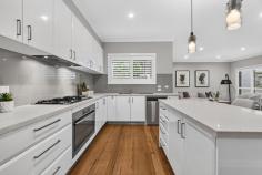 28 Waratah Avenue Burwood VIC 3125 $1,650,000-$1,750,000 Perfectly positioned in one of Burwood's most sought-after pockets, this impeccably presented residence delivers the ideal combination of space, style and low-maintenance living for growing families. Showcasing a versatile four-bedroom, three-bathroom floorplan across two spacious levels, every detail has been thoughtfully designed for modern comfort and effortless entertaining. A welcoming entry introduces a ground-floor master suite complete with walk-in robe and ensuite, offering flexibility for multi-generational living or guest accommodation. At the heart of the home, a stunning open-plan kitchen, dining and family zone is complemented by quality stone benchtops, extensive cabinetry, stainless steel appliances and a large island bench, creating the perfect setting for everyday living and entertaining. Sliding doors open to a beautifully landscaped alfresco deck, providing a private year-round outdoor retreat for family gatherings, weekend barbecues or quiet relaxation. Upstairs, a generous family retreat is surrounded by three oversized bedrooms, including a luxurious second master suite with walk-in robe and ensuite. A central bathroom and separate toilet service the remaining bedrooms, ensuring excellent functionality for busy households. Additional features include: Four spacious bedrooms, including two master suites with ensuites Three bathrooms plus powder room Multiple living zones across both levels Gourmet stone kitchen with quality appliances Covered entertaining deck and landscaped gardens Hardwood timber flooring Ducted heating and cooling Plantation shutters throughout Excellent storage options Enjoy a premium family lifestyle within easy reach of Burwood One Shopping Centre, Deakin University, PLC, Mount Scopus College, trams, parklands and convenient access to the CBD. A sophisticated family home offering exceptional space, quality and convenience in a prized Burwood location.