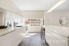 Ste 4/23 Peel St Adelaide SA 5000 $990,000 - $1,089,000 NEW YORK LOFT STYLE APARTMENT WITH UNBEATABLE INNER-CITY LOCATION PLEASE CALL FOR PRIVATE INSPECTION Cleverly restored in 2016, the redevelopment was envisioned to provide entire spaces with the flexibility to suit premium residential living. Offering rare versatility and a striking New York loft-style feel, this unique city-fringe space presents an exciting opportunity to create a one-of-a-kind residence. Set high on the 4th floor, the property enjoys a sense of seclusion while still being immersed in Adelaide’s thriving West End district, with sweeping north, west and easterly views across the city skyline. Home to some of the city’s best hospitality venues, and within walking distance of Rundle Mall and Adelaide Railway Station, the location is second to none. Inside, soaring ceilings, vast open spaces and abundant natural light create a true blank canvas. A fully equipped kitchen delivers premium functionality, with integrated NEFF induction cooktop, oven and microwave, a SMEG dishwasher, stainless steel splashback, Siema sink and a fully integrated Liebherr fridge/freezer. A concealed bathroom with shower and European laundry sits discreetly behind the kitchen, while block-out blinds, sheer curtains and quality finishes throughout enhance everyday comfort. The building offers intercom, lift and stair access, with a vestibule providing added security upon property entry. With its flexible floorplan and unbeatable location, 4/23-25 Peel Street presents a unique opportunity to secure a truly distinctive city residence within one of Adelaide’s most vibrant lifestyle precincts. FEATURES WE LOVE • Flexible floorplan • North, west and easterly city views • Open-plan layout + separate bedroom with wall-to-wall BIR • Secure building, high ceilings, quality fit-out, Tallowwood floors • Contemporary kitchen with NEFF appliances, SMEG dishwasher, Liebherr fridge/freezer • Concealed bathroom with linen storage + potential for European laundry • Sheer + block-out blinds • Balcony • Lift & stair access + intercom system LOCATION • Prime inner-city location, walk to Rundle Mall, Adelaide Oval & Adelaide Railway Station • Nearby dining at leading restaurants including favourites including Fugazzi, Leigh Street Wine Room, Peel Street Restaurant & Meat & Wine Co • Excellent public transport options with bus, tram & train all within short walking distance • Just 7km to Adelaide Airport PARKING • Multiple nearby parking facilities available with flexible subscription options