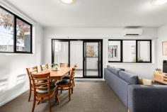 Unit 6/33 Rankins Rd Kensington VIC 3031 $450,000 Tremendous, trendy, tree house Featuring a tree top first floor position in a lively locale, moments to Parsons Street Park and Racecourse Road, this enormous one bedroom plus study apartment boasts two well-proportioned balconies and two rare under cover off street car spaces. Ideal for a home office–enter to your private study separated from living areas. Stainless steel kitchen appliances including a gas cooktop and dishwasher; ample bench space and breakfast bar preside over the kitchen with uninterrupted tree lined and pretty Victorian street scape views from the expansive picture window. Courtyard aspects welcome natural light into the living room, linked by a glass door to the undercover courtyard and all year-round alfresco dining with room for the largest BBQ. The double bedroom complete with a built-in robe and private courtyard also with picturesque views to tree lined Rankins Road is a quiet inner-city oasis. Split system heating/cooling also entices, as does the central bathroom with bath and separate shower. European laundry facilities include storage and separate laundry trough. Featuring ample natural light, above and beyond typical one bedroom accommodation and boasting tree lined views from every window and an airy feel, this is a property rarely seen and built at a time when space was a priority.
