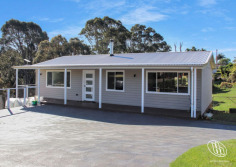 28 Thomson Parade Dalmeny NSW 2546 $765,000 North-Facing Living, Lake Views & Endless Lifestyle Appeal This well presented single-level home in Dalmeny, where comfort, practicality and relaxed living come together. Filled with natural light, the open plan living and dining area features reverse cycle air conditioning and a cosy fireplace, creating the perfect space to enjoy all year round. Designed with entertaining in mind, the living area seamlessly extends to a generous north-facing covered deck, where you can unwind while taking in the peaceful outlook across Mummaga Lake. At the heart of the home is a well-appointed kitchen offering ample bench space, abundant storage and a breakfast bar for casual dining. There are three comfortable bedrooms, each complete with ceiling fans, while two feature built-in wardrobes for added convenience. The bathroom offers a touch of luxury with underfloor heating, while a separate laundry completes the home's practical layout. Downstairs, a substantial workshop with an adjoining outdoor landing provides the ideal space for hobbies, storage, or conversion to a home office. Outside, the property continues to impress with ample off-street parking for multiple vehicles. Side access provides additional space for a caravan, trailer or boat, making this an ideal home for those who love the outdoors and the coastal lifestyle. The rear yard is fully fenced and an ideal space for kids and pets. We have obtained all information in this document from sources we believe to be reliable; however, we cannot guarantee its accuracy. Prospective purchasers are advised to carry out their own investigations...