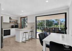 28 Thomson Parade Dalmeny NSW 2546 $765,000 North-Facing Living, Lake Views & Endless Lifestyle Appeal This well presented single-level home in Dalmeny, where comfort, practicality and relaxed living come together. Filled with natural light, the open plan living and dining area features reverse cycle air conditioning and a cosy fireplace, creating the perfect space to enjoy all year round. Designed with entertaining in mind, the living area seamlessly extends to a generous north-facing covered deck, where you can unwind while taking in the peaceful outlook across Mummaga Lake. At the heart of the home is a well-appointed kitchen offering ample bench space, abundant storage and a breakfast bar for casual dining. There are three comfortable bedrooms, each complete with ceiling fans, while two feature built-in wardrobes for added convenience. The bathroom offers a touch of luxury with underfloor heating, while a separate laundry completes the home's practical layout. Downstairs, a substantial workshop with an adjoining outdoor landing provides the ideal space for hobbies, storage, or conversion to a home office. Outside, the property continues to impress with ample off-street parking for multiple vehicles. Side access provides additional space for a caravan, trailer or boat, making this an ideal home for those who love the outdoors and the coastal lifestyle. The rear yard is fully fenced and an ideal space for kids and pets. We have obtained all information in this document from sources we believe to be reliable; however, we cannot guarantee its accuracy. Prospective purchasers are advised to carry out their own investigations...